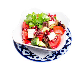 Tomato salad with feta cheese and pomegranate.