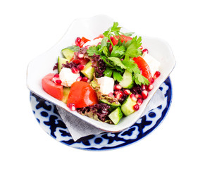 Tomato salad with feta cheese and pomegranate.