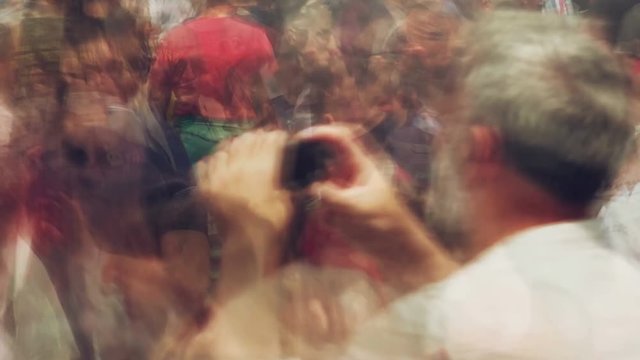 Blur crowd of people on street, unrecognizable crowded population as urban background, abstract time lapse footage