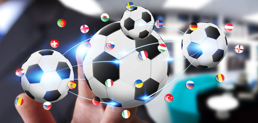 Businessman holding football in his hand