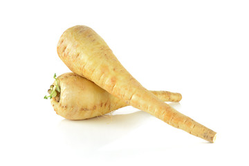 two fresh parsnip roots on a white background - obrazy, fototapety, plakaty