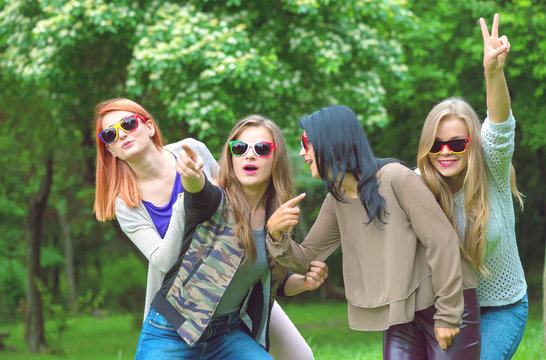 Happy friends posing together on a summers day