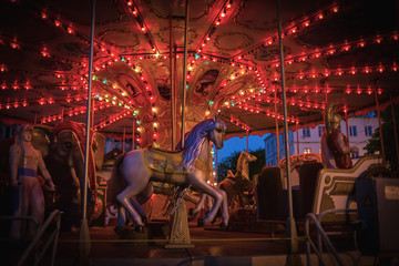 Fototapeta na wymiar Night children's carousel with lights