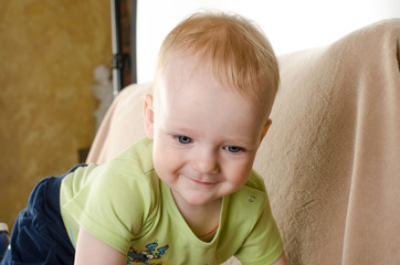 Portrait of a crawling baby on the carpet      