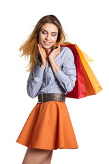 Shopping woman holding bags, isolated on white studio background