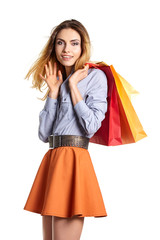Shopping woman holding bags, isolated on white studio background