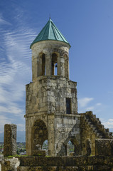 bell tower of the old church against the blue sky