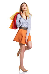 Shopping woman holding bags, isolated on white studio background