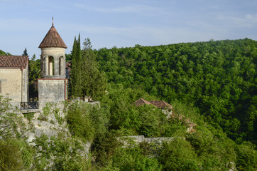 Fototapeta na wymiar landscape with old church on the green hill