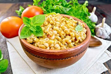 Barley porridge with basil on board