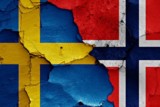flags of Sweden and Norway painted on cracked wall