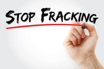 Hand writing Stop Fracking with marker, business concept background