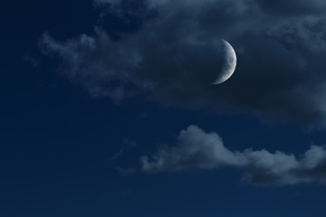 Naklejka na ściany i meble young growing moon in night sky with clouds, no stars