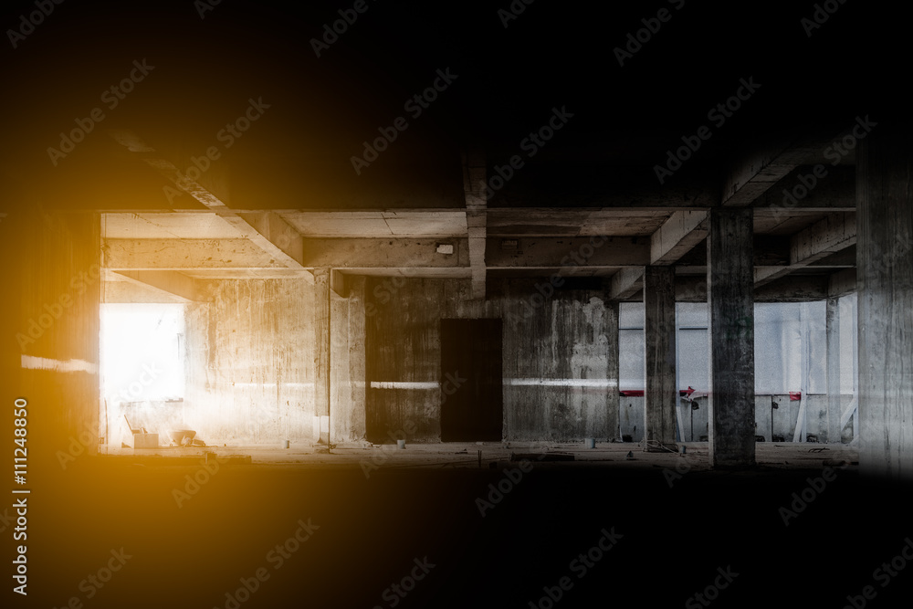 Poster lighting from window in abandoned building