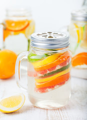 Detox fruit infused flavored water. Refreshing summer homemade lemonade cocktail
