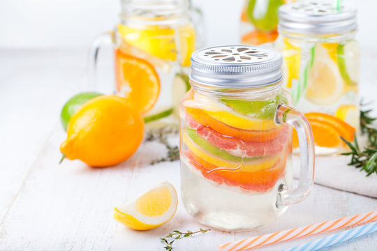 Detox fruit infused flavored water. Refreshing summer homemade lemonade cocktail