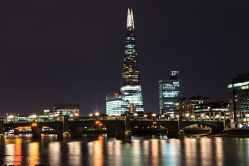 Fototapeta na wymiar The Shard skyscraper and Thames river at sunset in London, UK