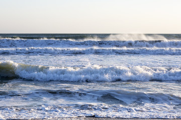 The waves of the Pacific ocean, the beach landscape. The ocean and waves during strong winds in United States, Santa Monica.