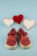 red shoes for little girl / portrait of little girl shoes with hearts