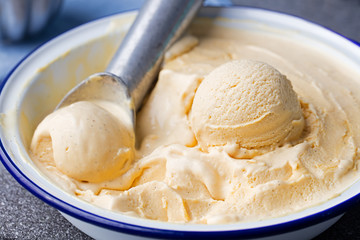 Homemade vanilla, caramel ice cream in vintage bowl Organic product
