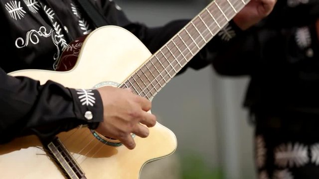 A man plays the guitar, close-up of hands. Latin American, Spanish, Mexican musician