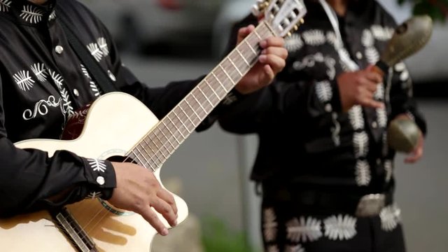 A man plays the guitar, close-up of hands. Latin American, Spanish, Mexican musician