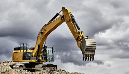 Constuction industry excavator heavy equipment on mountain © 1jaimages
