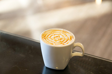white cup caramel macchiato