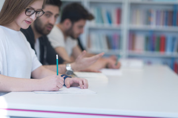 group of students study together in classroom