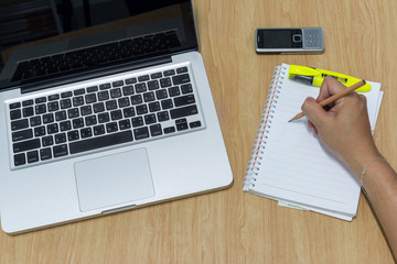 an office accessories on a wooden table background