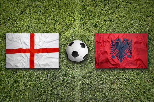 England vs. Albania flags on soccer field