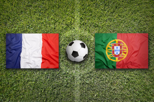 France vs. Portugal flags on soccer field