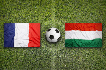 France vs. Hungary flags on soccer field