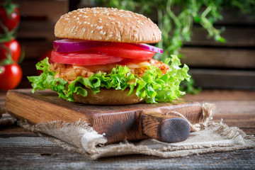 Closeup of tasty burger with vegetables