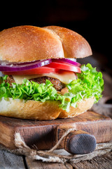 Closeup of cold drink with homemade burger