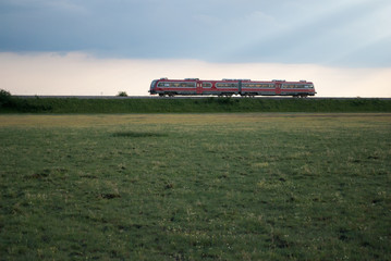 Train on railway in the meadow