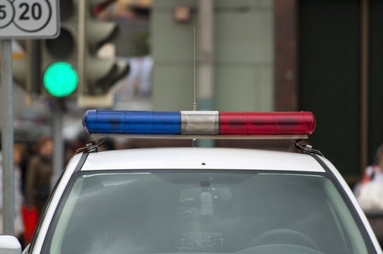 The roof-mounted lightbar of an emergency vehicle