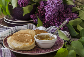 Pancakes for breakfast with plum jam and lilac   