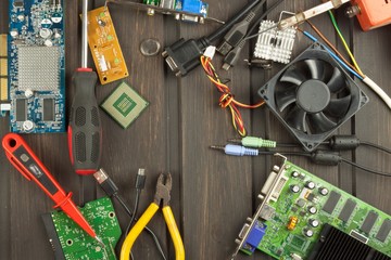 Table electronics repairman. Home computer repair. Desktop clutter electronics repairman. Recycling...