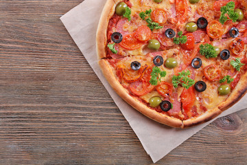 Tasty pizza with sausage and vegetables