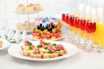 Set of cold snacks, canape, beverages, closeup