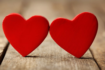 Wooden hearts on rustic wooden background