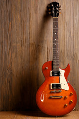 Fototapeta premium Electric guitar on wooden background