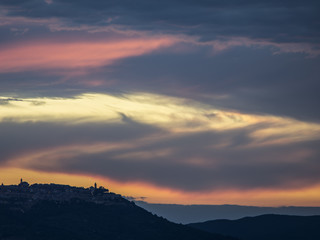 dawn sky above the mountains of tuscany, italy