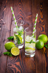 Lemonade drink on a wooden background