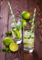 Lemonade drink on a wooden background