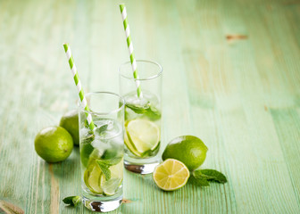 Lemonade drink on a wooden background
