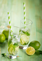 Lemonade drink on a wooden background