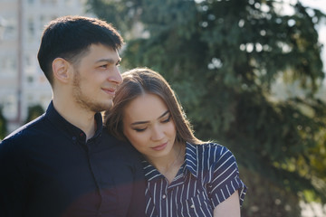 Loving young beautiful calm couple close up portrait