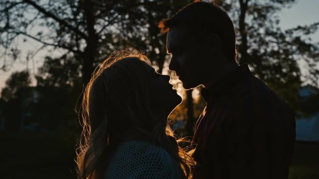 Young romantic couple first kiss